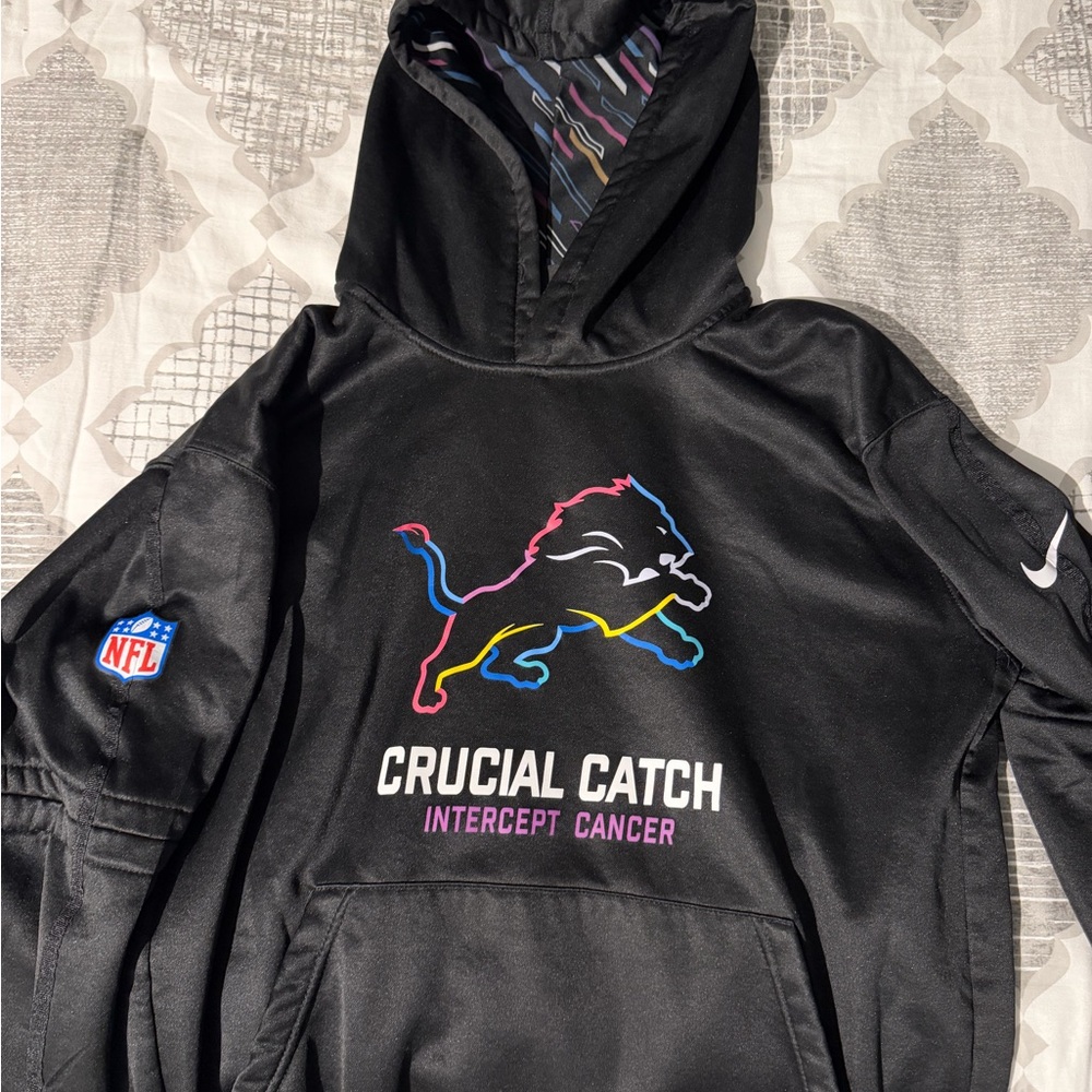 NFL Black Crucial Catch Hoodie with Colorful Lion Design